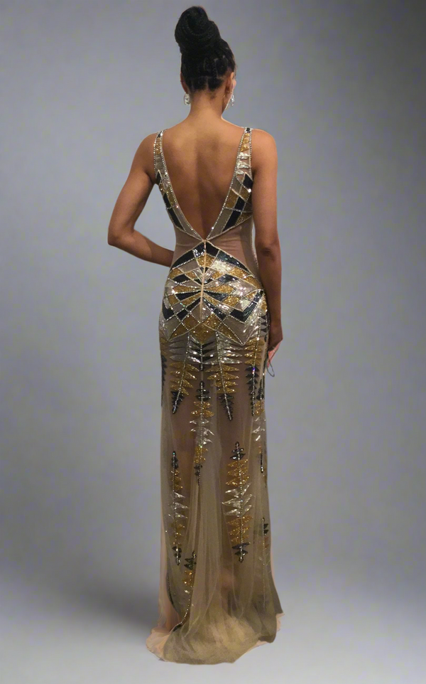 Jovani 38270 sequin embellished evening gown with geometric pattern, mermaid silhouette, and sheer fabric detailing.