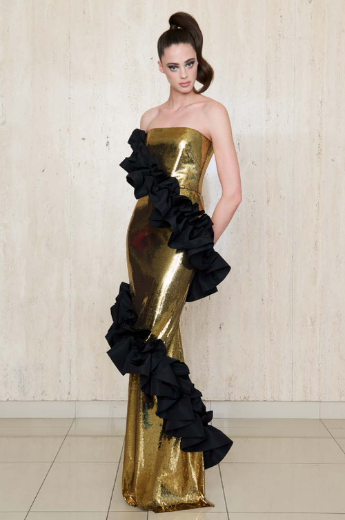 Greta Constantine SUNEV Gown – Strapless gold metallic gown with ruffle trims cascading down the silhouette, perfect for red carpet and formal evening events.