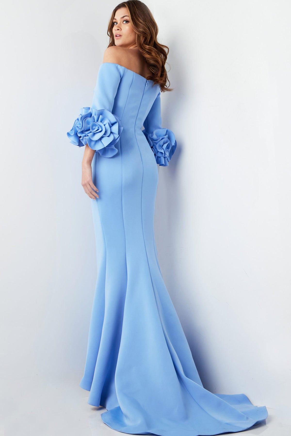 Jovani 23716 Off-the-Shoulder Scuba Gown – Elegant light blue gown featuring an off-the-shoulder neckline, sheath silhouette, and floral sleeve details.