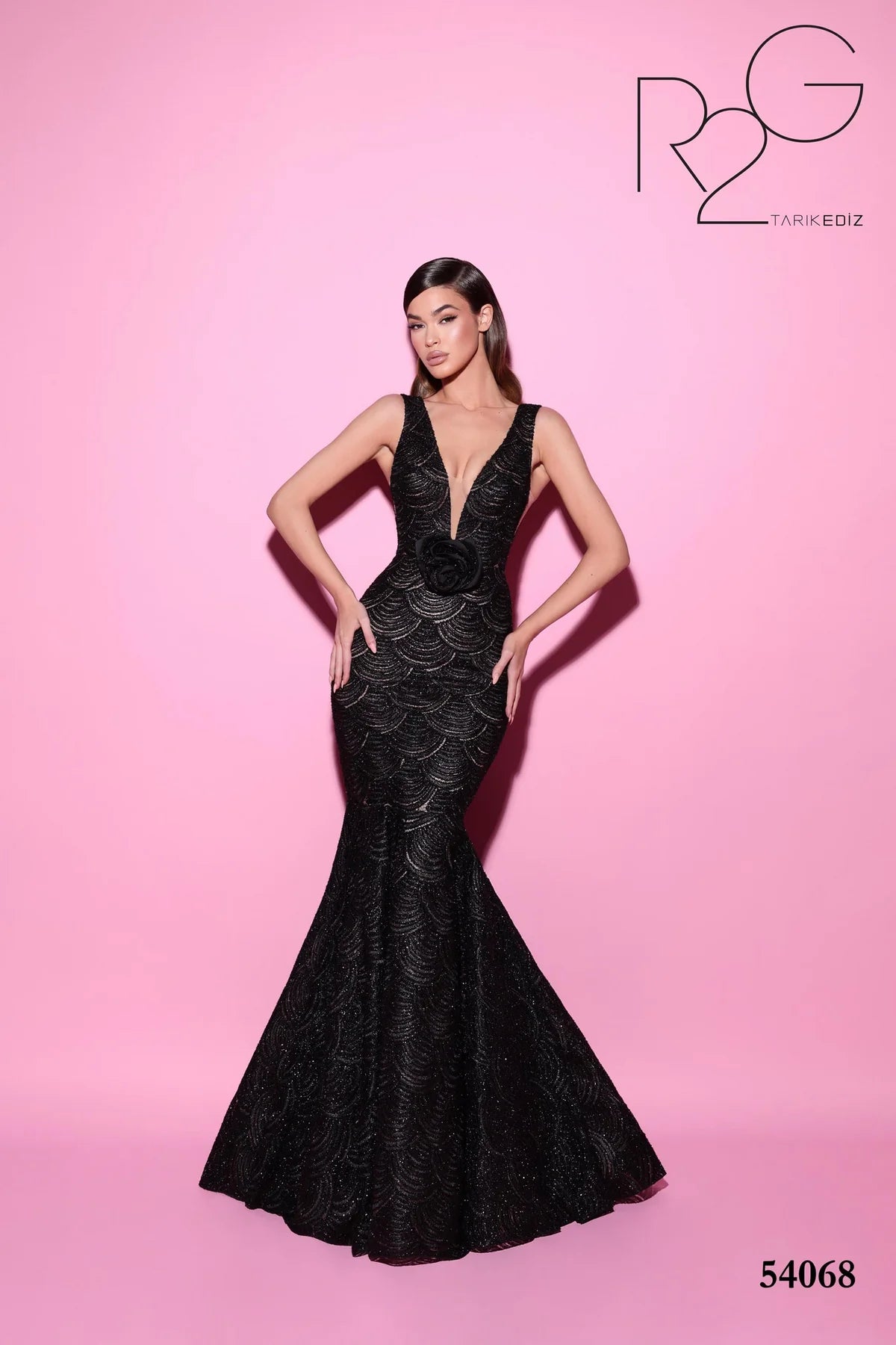 Tarik Ediz 54068 Mermaid Gown with Plunging V-Neck and Patterned Fabric – a bold, elegant choice for formal evening events.