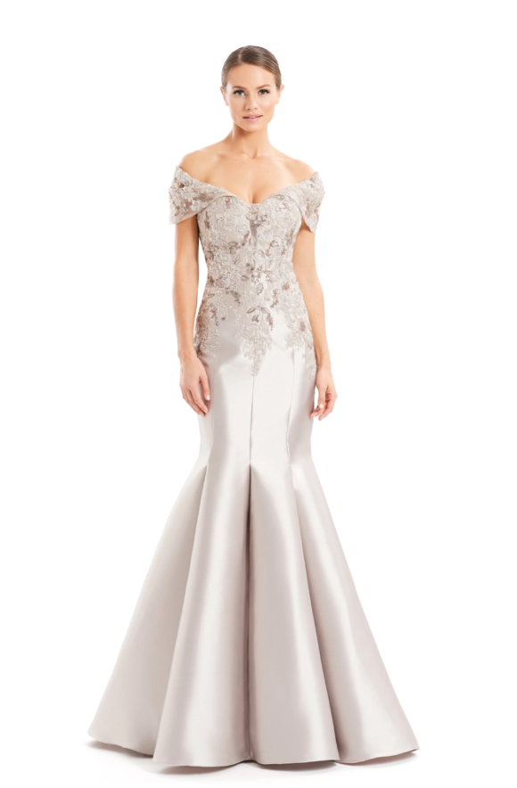 Alexander by Daymor 1667, an off-shoulder evening gown with intricate embroidery, showcasing a form-fitting silhouette and mermaid skirt, perfect for formal events and weddings.  Model is wearing Silver Taupe.