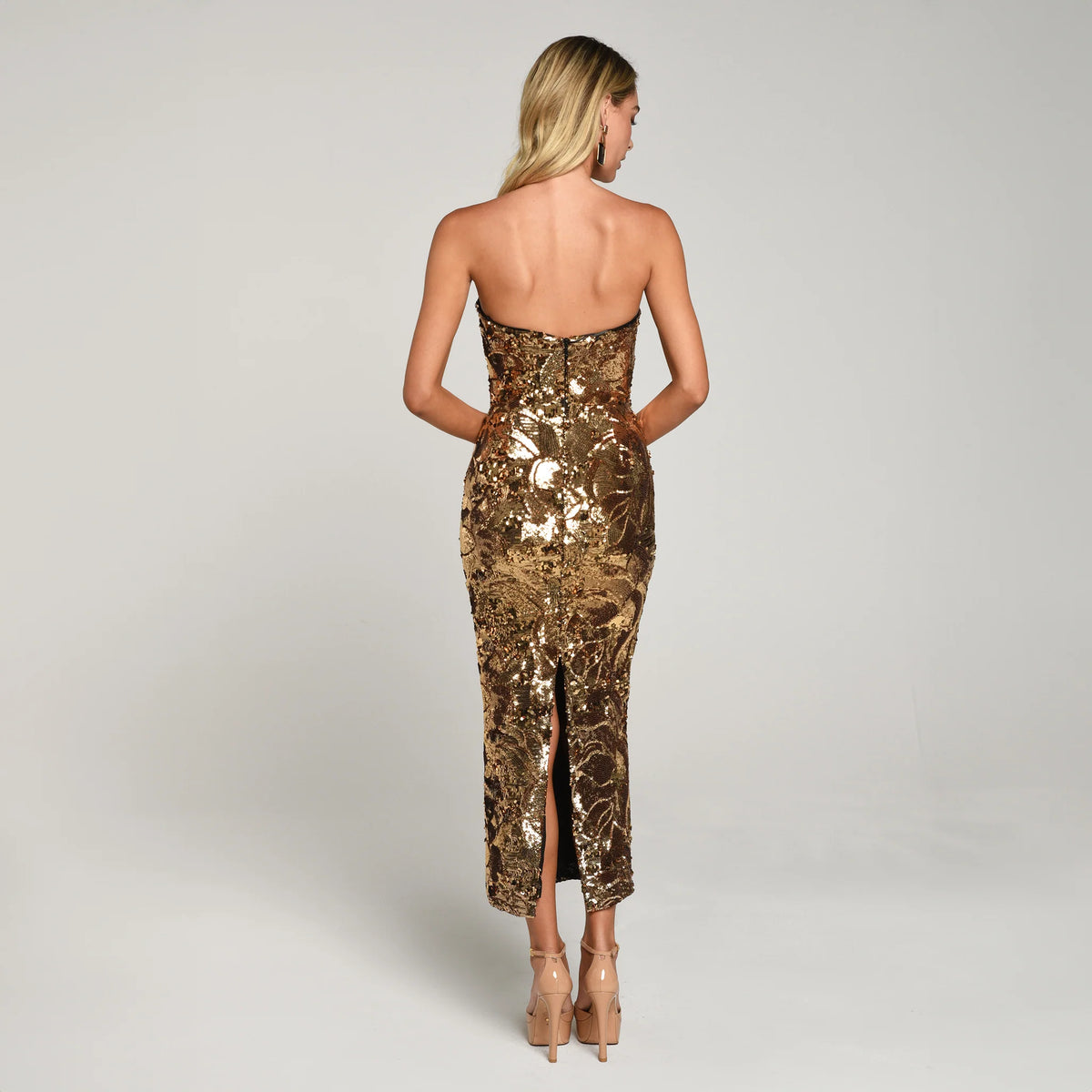 Helsi Leslie Sequin Body-Con Evening Dress – featuring abstract sequin pattern, structured stretch bodice, and boning for support.  The model is wearing the Leslie in ANTIQUE-GOLD.  Front View.