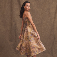 Helsi Stephanie Fit and Flare Midi Dress - A formal evening dress featuring a demi neckline, scoop back, adjustable straps, embroidered lace bodice, and a crepe skirt with asymmetrical floral patterns.