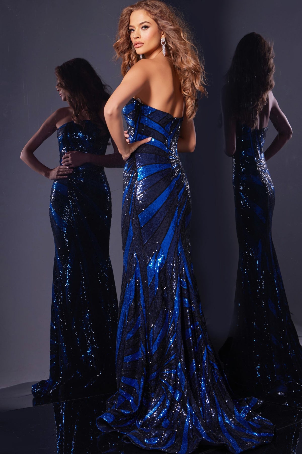 Jovani 40765 Strapless Sequin Evening Gown - Stunning strapless gown featuring an intricate sequin pattern, fitted bodice, and floor-length skirt.  Model is wearing the dress in Navy/Royal.