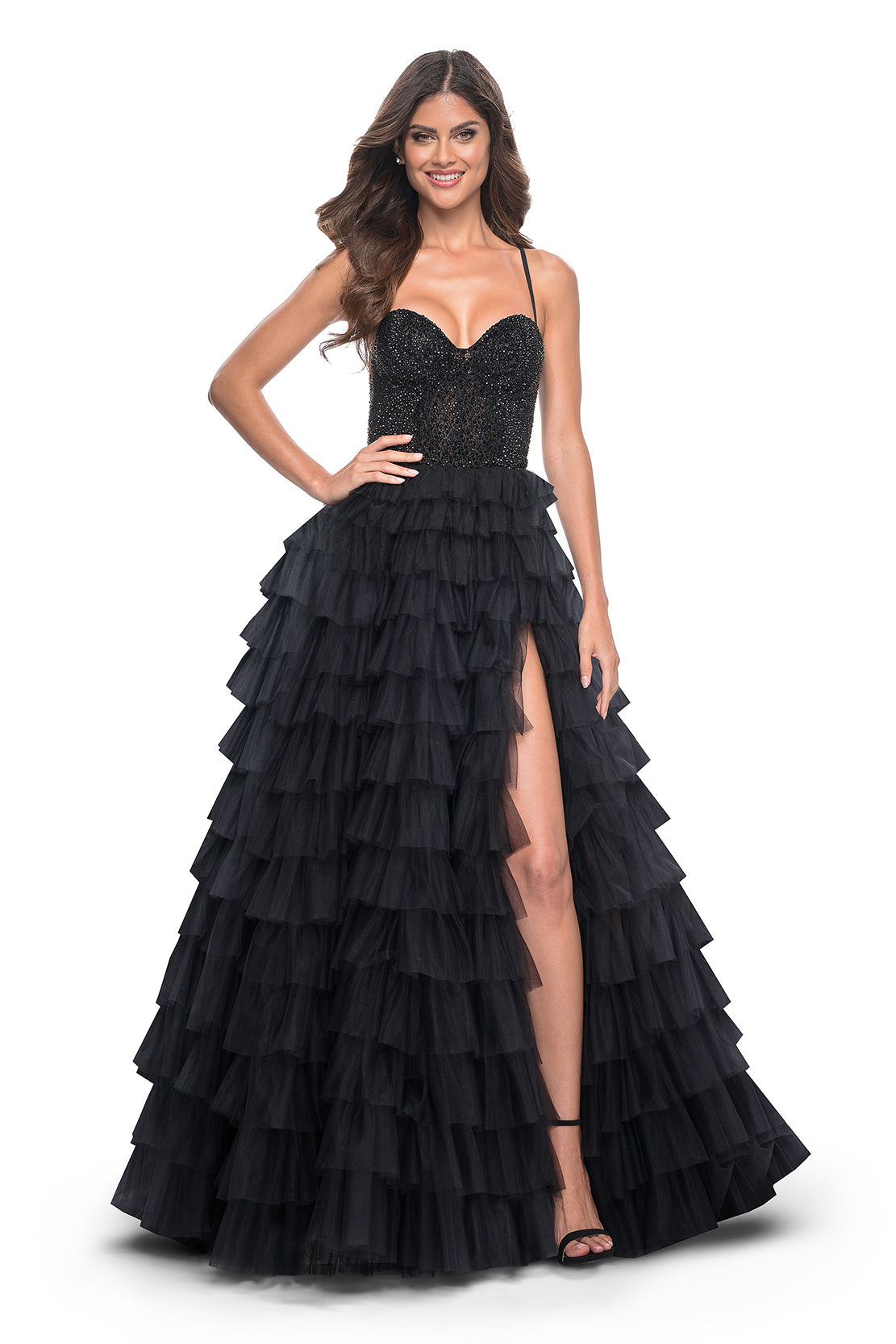 La Femme 32002 Glamorous Rhinestone Embellished Prom Dress - A stunning prom dress featuring a tiered ruffle skirt, fully rhinestone embellished bodice, high slit, and adjustable lace-up back for an elegant and customized look.