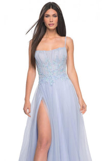 La Femme 32293 - A graceful A-line tulle prom gown featuring a high slit, square neckline, and beaded lace applique for an enchanting look. The model is wearing the dress in light periwinkle.