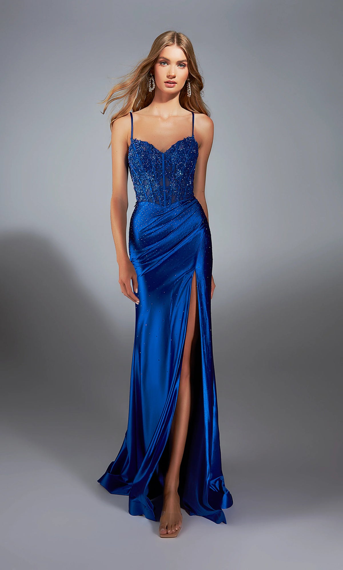 Paris Ayce 61827 Stretch Satin Corset Gown in royal blue featuring an embellished bodice, a thigh-high slit, and a lace-up back. Ideal for prom and evening events.