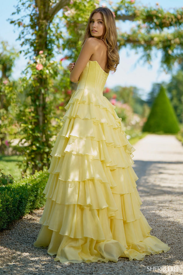 Sherri Hill 56911 strapless satin corset gown in yellow with a chiffon ruffle skirt and high slit, perfect for pageants, formal events, and prom.