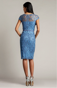 Tadashi Shoji BJK18795 Embroidered Tulle Sheath Dress - Sophisticated knee-length dress with sparkly paillette embellishments, plunging illusion neckline, attached grosgrain elastic belt, and fitted sheath silhouette.