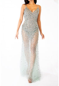 Terani 241P2071 Sparkling Plunge Neckline Evening Gown - A daring and sophisticated gown with a plunging neckline, bodycon silhouette, and sparkling embellishments. Ideal for prom and evening formal events. The model is wearing the dress in the color gunmetal.