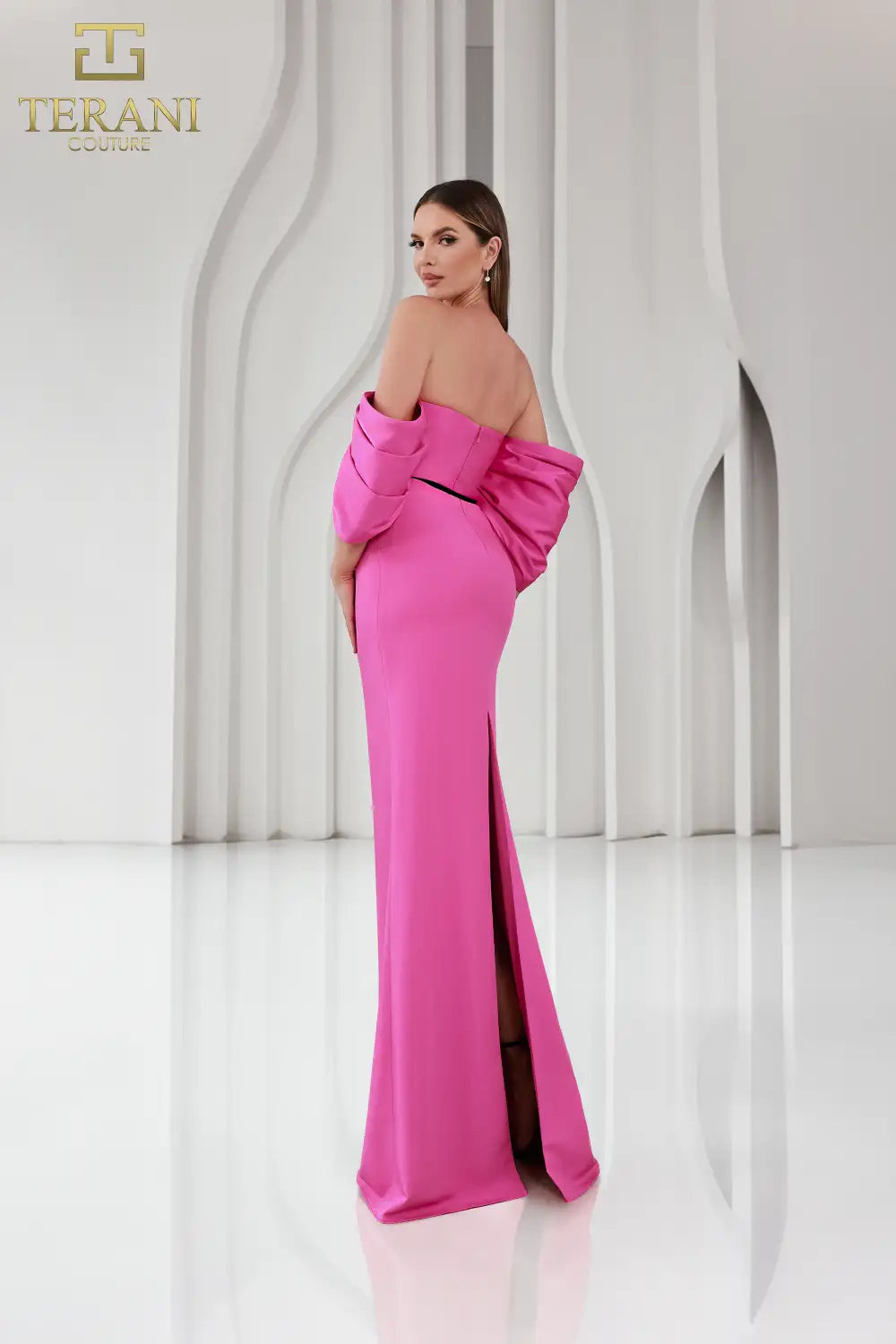 Terani Couture 251E4204 Off-Shoulder Matte Satin Gown - Features a sheath silhouette, straight neckline, back slit, and luxurious matte satin fabric for formal elegance.  Dress in fuchsia.  back View.