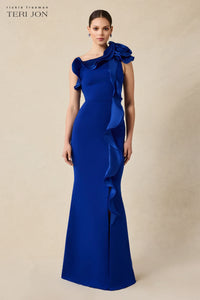 Teri Jon 249043 one-shoulder gown featuring a cascading ruffle detail and fitted silhouette. Perfect for formal evenings and mother of the bride or groom.  Model is wearing the dress in the color cobalt.