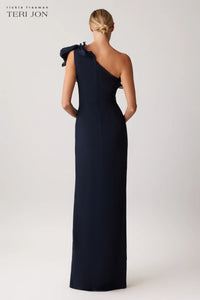 Teri Jon 249043 one-shoulder gown featuring a cascading ruffle detail and fitted silhouette. Perfect for formal evenings and mother of the bride or groom.  Model is wearing the dress in the color navy.  Back View.